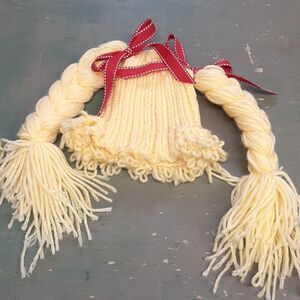 Adorable yarn hat for a baby or doll.